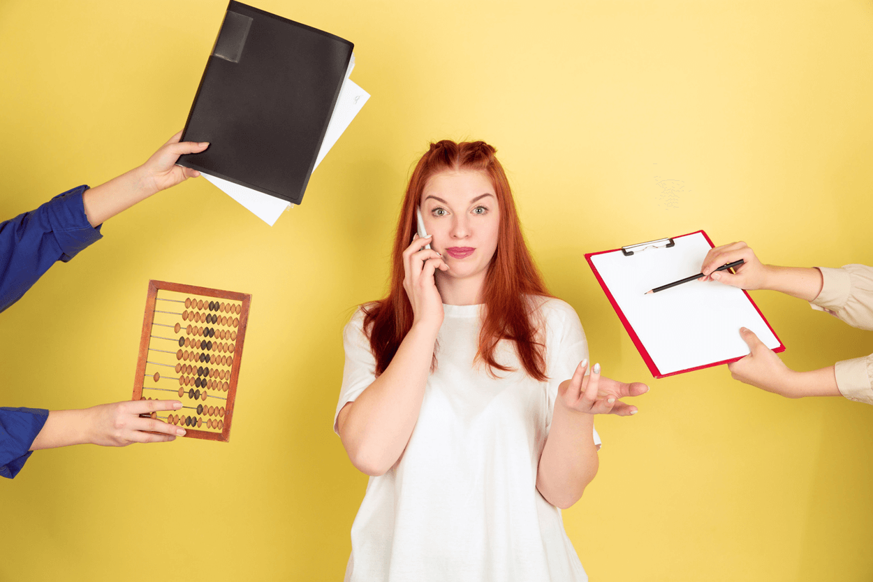  lady in center with many things being handed to her (yellow background)